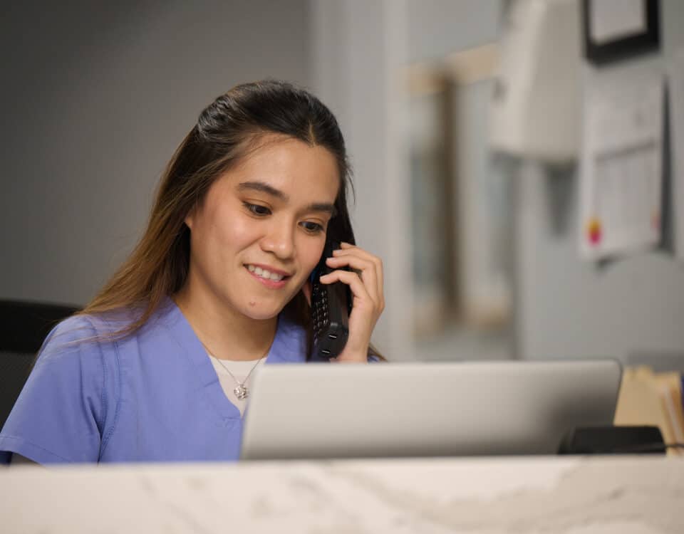 Infusion Nurse Working in Front Office