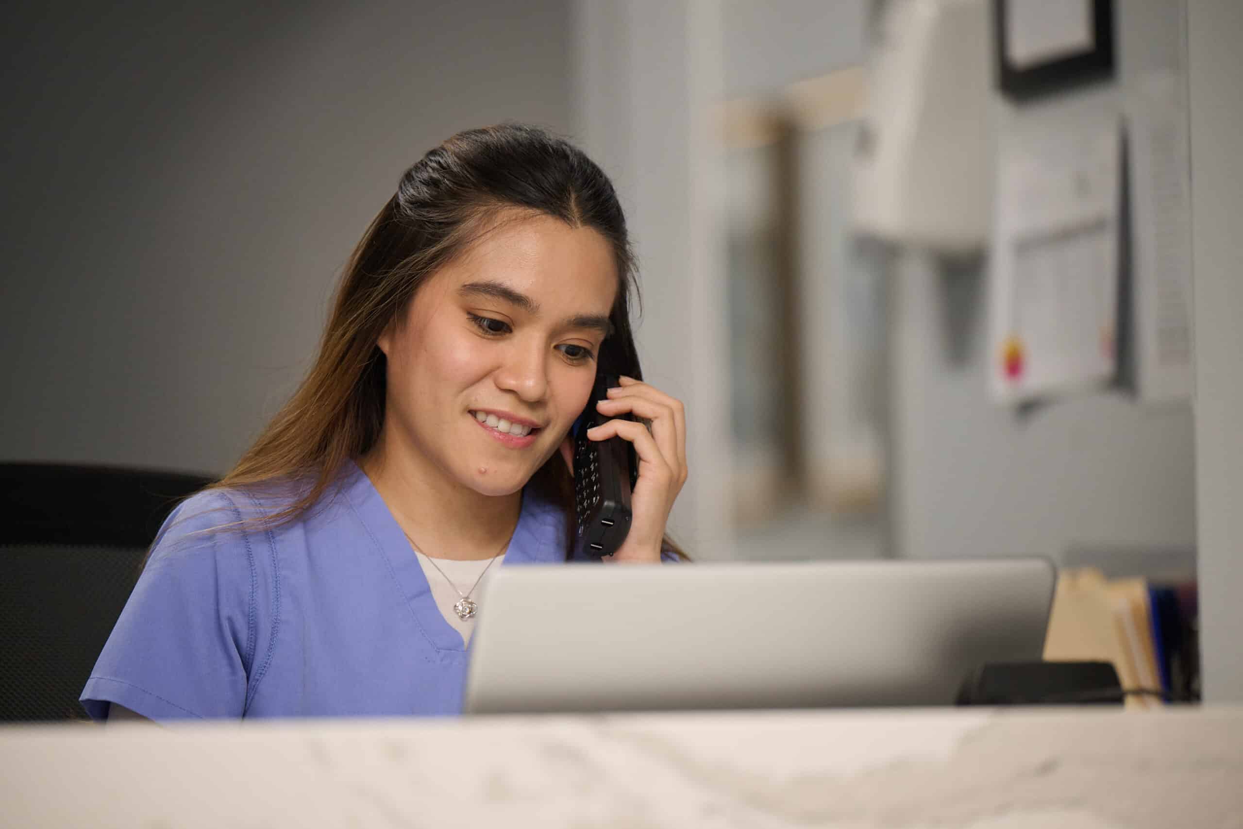 Infusion Nurse Working in Front Office